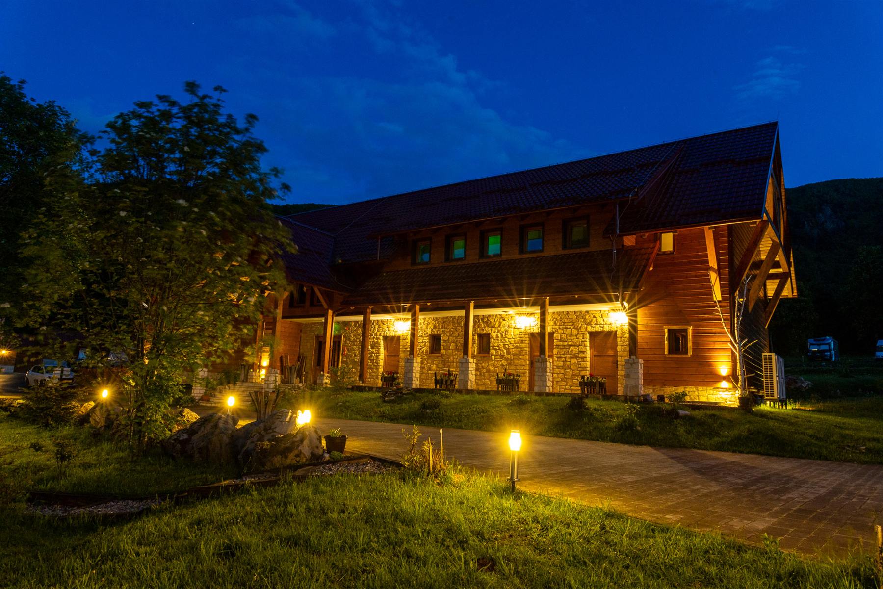 Mrzlin Grad lodge glowing at night