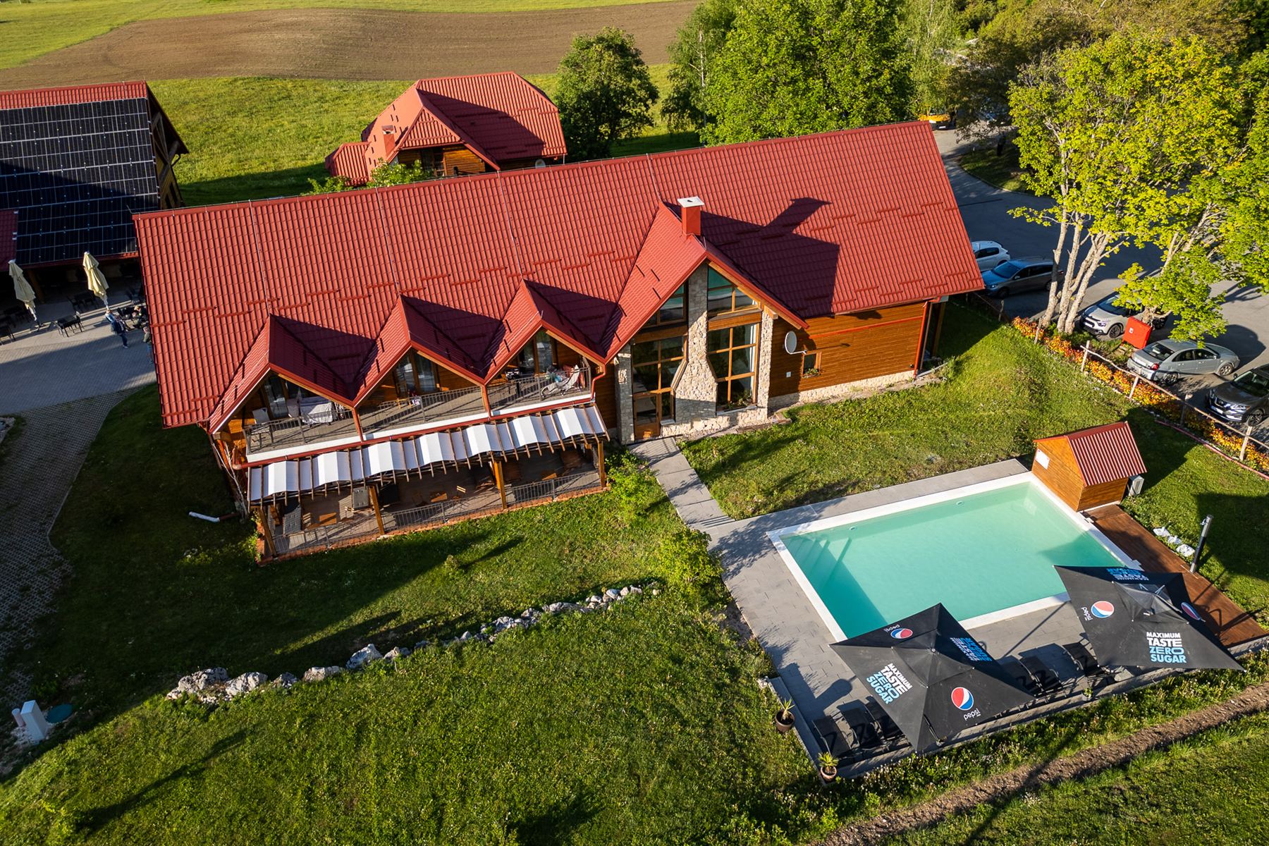 Aerial view of the outdoor pool beside the main lodge